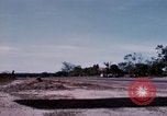 Image of UH-1Ds' and UH-1Bs' helicopters landing US troops during Operation Att Dau Tieng Vietnam, 1966, second 48 stock footage video 65675026866