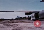 Image of UH-1Ds' and UH-1Bs' helicopters landing US troops during Operation Att Dau Tieng Vietnam, 1966, second 49 stock footage video 65675026866