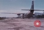 Image of UH-1Ds' and UH-1Bs' helicopters landing US troops during Operation Att Dau Tieng Vietnam, 1966, second 50 stock footage video 65675026866