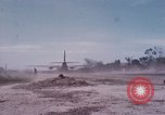Image of UH-1Ds' and UH-1Bs' helicopters landing US troops during Operation Att Dau Tieng Vietnam, 1966, second 53 stock footage video 65675026866