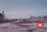 Image of UH-1Ds' and UH-1Bs' helicopters landing US troops during Operation Att Dau Tieng Vietnam, 1966, second 56 stock footage video 65675026866