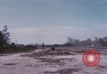 Image of UH-1Ds' and UH-1Bs' helicopters landing US troops during Operation Att Dau Tieng Vietnam, 1966, second 62 stock footage video 65675026866