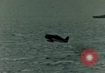 Image of a fighter jet rapidly sinking in water United States USA, 1965, second 27 stock footage video 65675027018