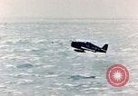 Image of a fighter jet rapidly sinking in water United States USA, 1965, second 28 stock footage video 65675027018