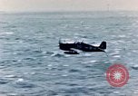 Image of a fighter jet rapidly sinking in water United States USA, 1965, second 30 stock footage video 65675027018