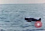 Image of a fighter jet rapidly sinking in water United States USA, 1965, second 31 stock footage video 65675027018