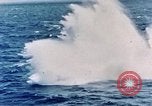 Image of a fighter jet rapidly sinking in water United States USA, 1965, second 35 stock footage video 65675027018