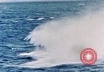 Image of a fighter jet rapidly sinking in water United States USA, 1965, second 37 stock footage video 65675027018