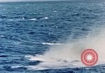 Image of a fighter jet rapidly sinking in water United States USA, 1965, second 38 stock footage video 65675027018