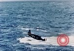 Image of a fighter jet rapidly sinking in water United States USA, 1965, second 40 stock footage video 65675027018