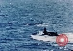 Image of a fighter jet rapidly sinking in water United States USA, 1965, second 41 stock footage video 65675027018