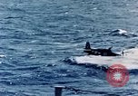 Image of a fighter jet rapidly sinking in water United States USA, 1965, second 43 stock footage video 65675027018