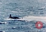 Image of a fighter jet rapidly sinking in water United States USA, 1965, second 47 stock footage video 65675027018