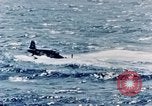 Image of a fighter jet rapidly sinking in water United States USA, 1965, second 48 stock footage video 65675027018
