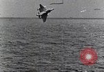 Image of a fighter jet rapidly sinking in water United States USA, 1965, second 50 stock footage video 65675027018