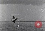 Image of a fighter jet rapidly sinking in water United States USA, 1965, second 51 stock footage video 65675027018