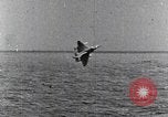 Image of a fighter jet rapidly sinking in water United States USA, 1965, second 52 stock footage video 65675027018