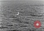 Image of a fighter jet rapidly sinking in water United States USA, 1965, second 56 stock footage video 65675027018