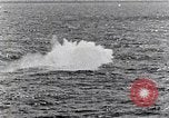 Image of a fighter jet rapidly sinking in water United States USA, 1965, second 58 stock footage video 65675027018