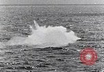 Image of a fighter jet rapidly sinking in water United States USA, 1965, second 59 stock footage video 65675027018