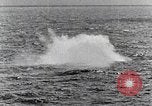 Image of a fighter jet rapidly sinking in water United States USA, 1965, second 60 stock footage video 65675027018