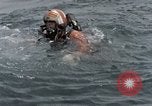 Image of jet pilot water rescue United States USA, 1965, second 3 stock footage video 65675027024