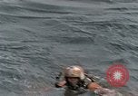 Image of jet pilot water rescue United States USA, 1965, second 4 stock footage video 65675027024