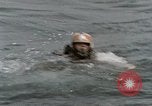 Image of jet pilot water rescue United States USA, 1965, second 5 stock footage video 65675027024
