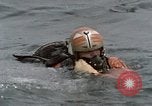 Image of jet pilot water rescue United States USA, 1965, second 7 stock footage video 65675027024
