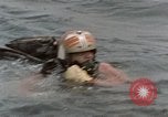 Image of jet pilot water rescue United States USA, 1965, second 8 stock footage video 65675027024