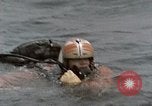 Image of jet pilot water rescue United States USA, 1965, second 9 stock footage video 65675027024