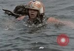 Image of jet pilot water rescue United States USA, 1965, second 10 stock footage video 65675027024