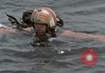 Image of jet pilot water rescue United States USA, 1965, second 11 stock footage video 65675027024