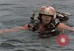 Image of jet pilot water rescue United States USA, 1965, second 13 stock footage video 65675027024