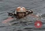 Image of jet pilot water rescue United States USA, 1965, second 15 stock footage video 65675027024