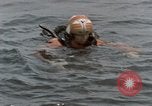 Image of jet pilot water rescue United States USA, 1965, second 16 stock footage video 65675027024