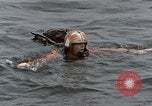 Image of jet pilot water rescue United States USA, 1965, second 17 stock footage video 65675027024