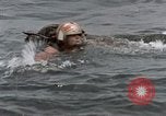 Image of jet pilot water rescue United States USA, 1965, second 18 stock footage video 65675027024