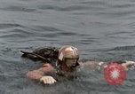 Image of jet pilot water rescue United States USA, 1965, second 19 stock footage video 65675027024