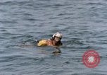 Image of jet pilot water rescue United States USA, 1965, second 25 stock footage video 65675027024