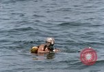 Image of jet pilot water rescue United States USA, 1965, second 26 stock footage video 65675027024