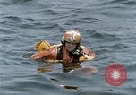 Image of jet pilot water rescue United States USA, 1965, second 29 stock footage video 65675027024