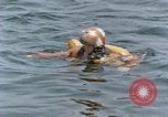 Image of jet pilot water rescue United States USA, 1965, second 30 stock footage video 65675027024