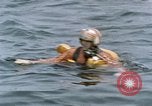 Image of jet pilot water rescue United States USA, 1965, second 31 stock footage video 65675027024