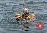 Image of jet pilot water rescue United States USA, 1965, second 32 stock footage video 65675027024
