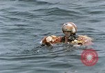 Image of jet pilot water rescue United States USA, 1965, second 33 stock footage video 65675027024