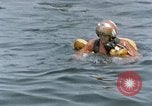 Image of jet pilot water rescue United States USA, 1965, second 34 stock footage video 65675027024