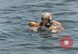 Image of jet pilot water rescue United States USA, 1965, second 35 stock footage video 65675027024