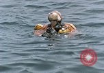 Image of jet pilot water rescue United States USA, 1965, second 37 stock footage video 65675027024