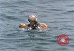 Image of jet pilot water rescue United States USA, 1965, second 39 stock footage video 65675027024